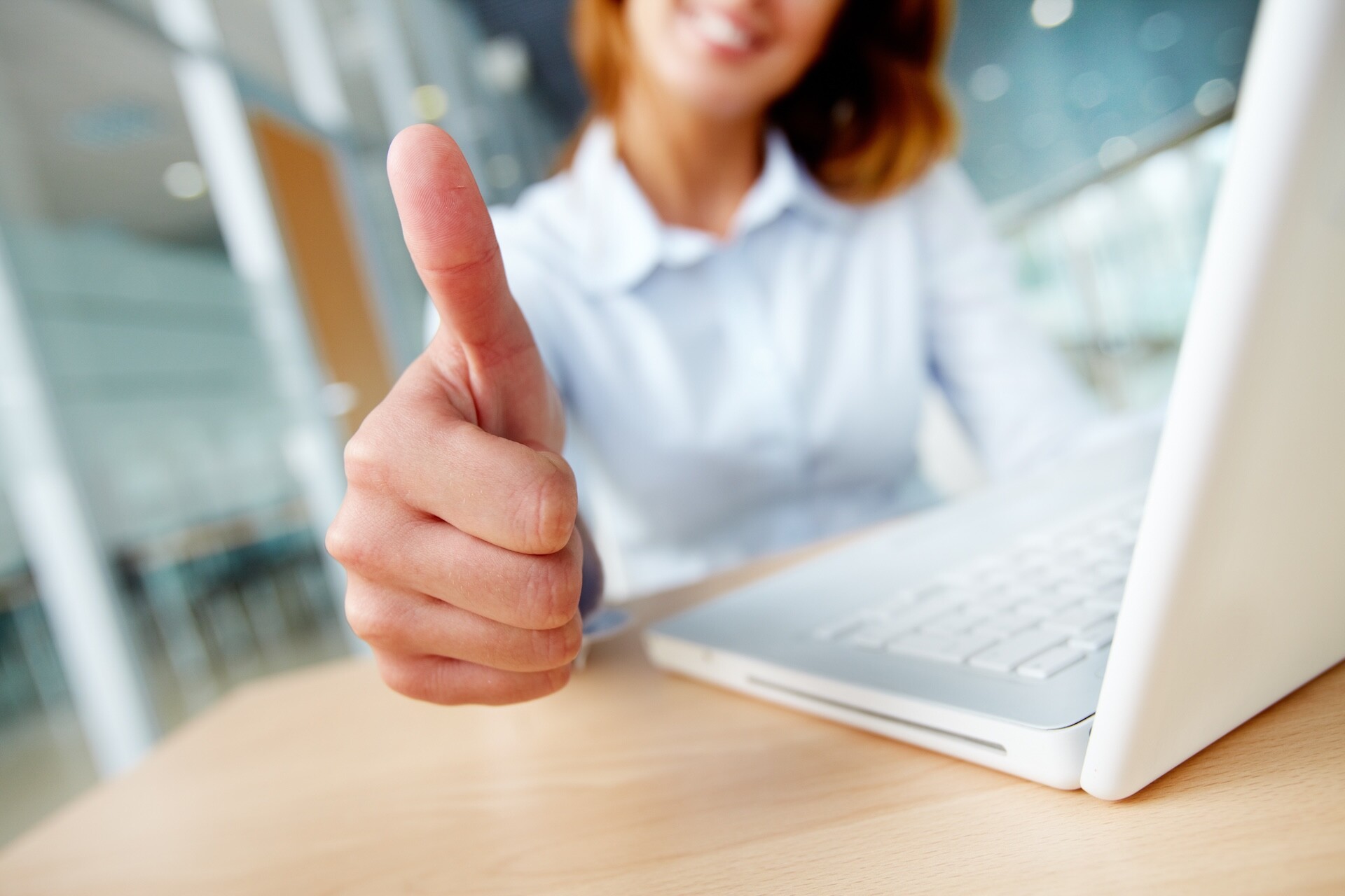Thumbs up close up success agreement