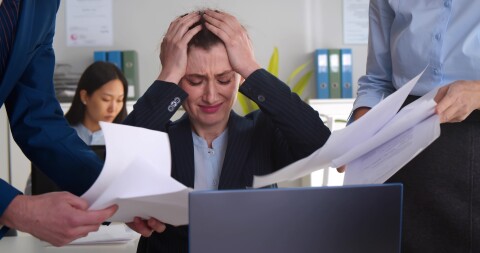 Young woman, many papers